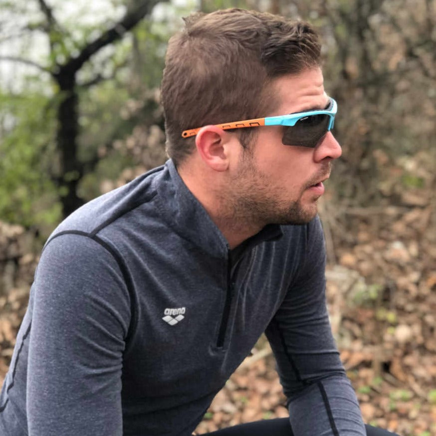 trail running glasses with 3 included lenses infinite optic light blue