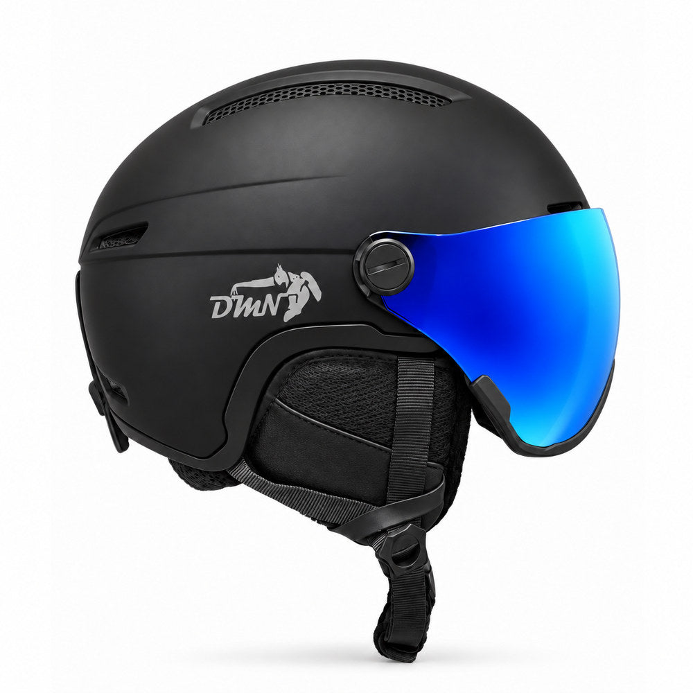 Side view of DMN NIVAL-V ski and snowboard helmet with integrated REVO Mirror Blue S2 visor, matte black shell and padded ear protection.